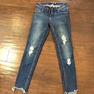 Blue jeans- ripped with frayed hems at ankle